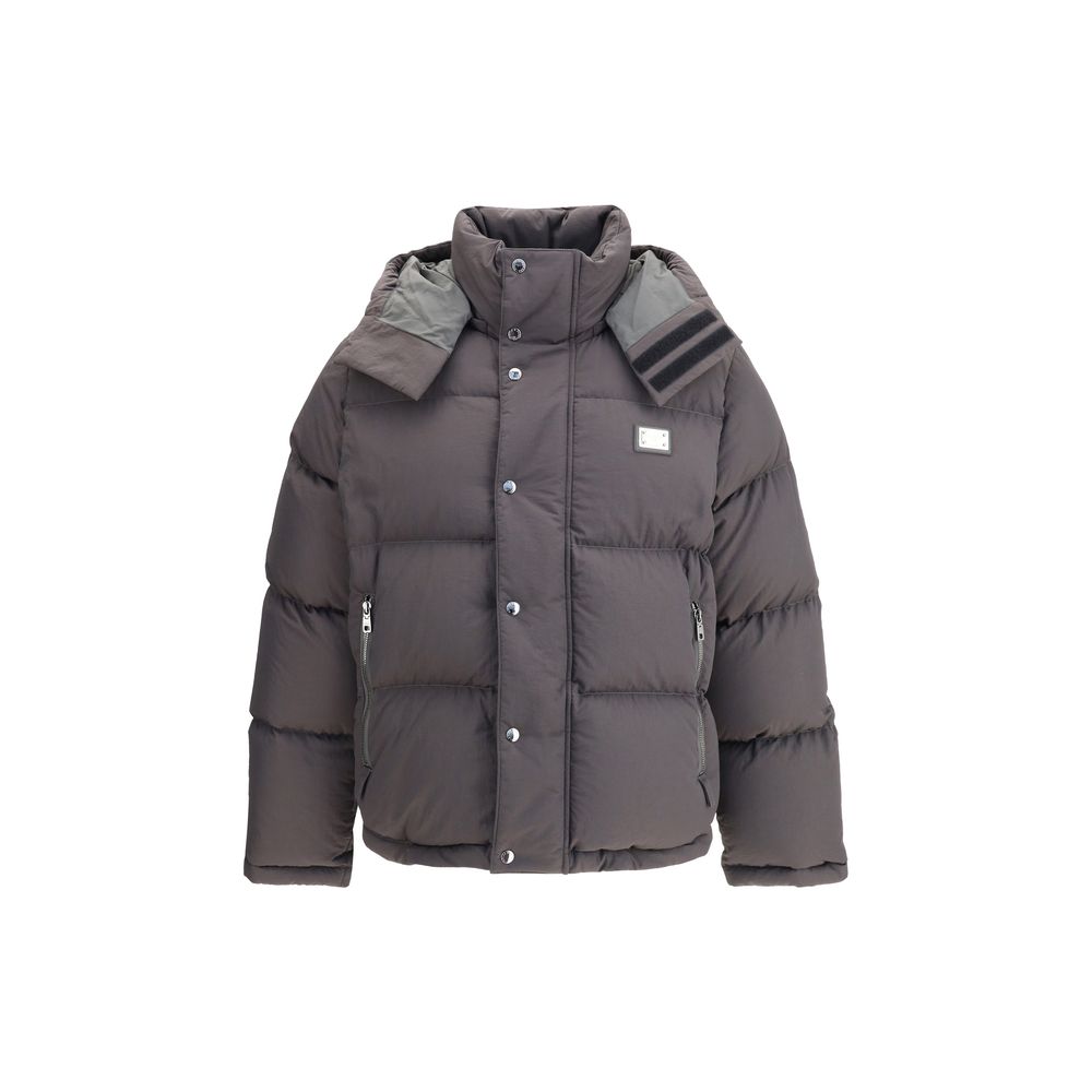 Gray puffer jacket with a hood on a white background